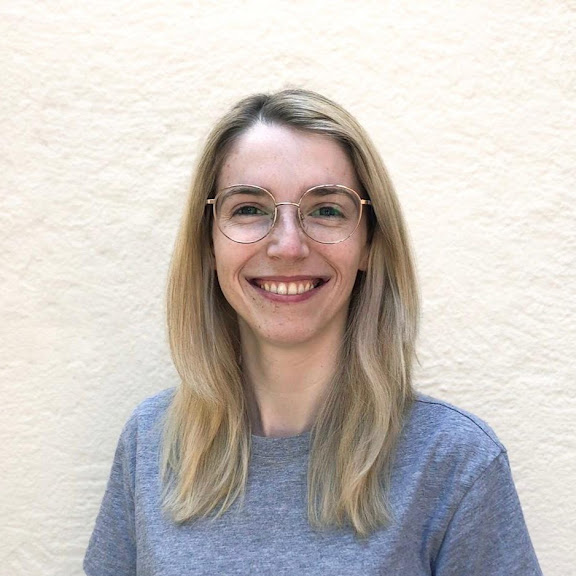 An image of Kerenza smiling in front of a white background